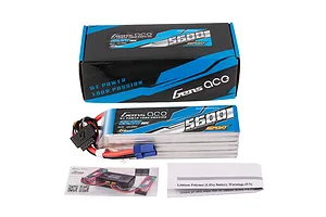 Gens Ace G-Tech Sport 6S 5600mAh LiPo battery, its cardboard packaging, a G-Tech instruction card, and a safety warning sheet on a white background.