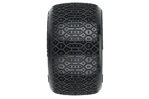 A top-down view of a black Pro-Line 2.2 inch RC stadium truck tyre showing the detailed hexagonal and block tread pattern.