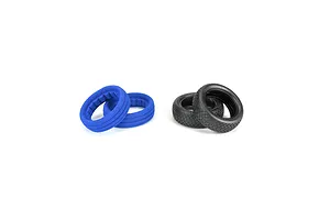 Two black Pro-Line 2.2 inch RC buggy front tyres and two blue foam inserts arranged on a white background.
