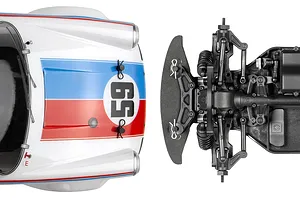 Top-down view of the HPI Sport 3 RC car showing the white Porsche body shell with Brumos livery and the exposed black plastic chassis front suspension.
