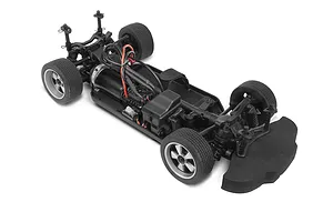 A high-angle studio shot of an HPI Sport 3 RC car chassis without its body shell, showing the motor, drivetrain, and foam bumper.