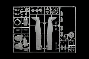 A grey plastic sprue containing various model aircraft parts for an Italeri 1/48 T-6G Texan kit, including fuselage halves, engine, and propeller.