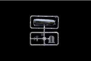 A clear plastic sprue containing two transparent aircraft canopy parts for a model kit, set against a black background.