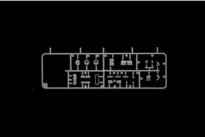 A grey plastic sprue containing various small model tank parts, including wheels and accessories, set against a solid black background.