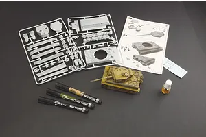 Italeri 1/56 scale Tiger I tank model kit contents including plastic sprues, instruction manual, decals, glue, and three paint markers on a dark surface.