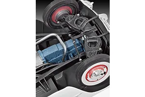 Close-up view of the detailed chassis and blue engine block of a 1/24 scale 1953 Chevrolet Corvette model car kit.