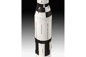 A close-up view of a Revell 1/96 scale Saturn V rocket model, showing the white and black cylindrical body with United States lettering.