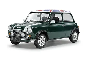 A fully assembled 1/12 scale Tamiya Mini Cooper 1.3i model car painted British racing green with a Union Jack roof design on a white background.