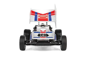 Rear view of a Team Associated RC10 Sprint RC car featuring a large white wing with red and blue racing stripes and RC10 branding.