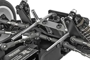 Close-up of the front suspension and steering assembly on a Team Associated RC10 Sprint car chassis.