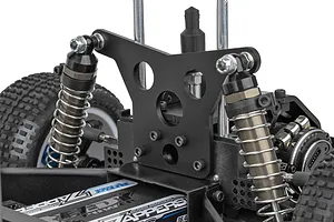 Close-up of the rear suspension tower and shock absorbers on a Team Associated RC10 Sprint car chassis.
