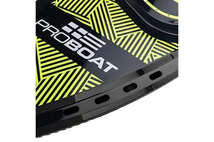 Close-up of the deck of a Pro Boat Sonicwake RC boat featuring a black and neon yellow geometric pattern and the Pro Boat logo.