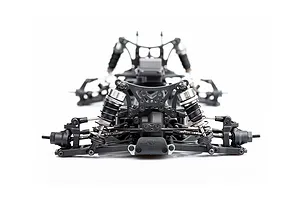 Front view of an LRP Antix S10 Blast BX3 RC buggy chassis showing suspension, shocks, and steering components on a white background.