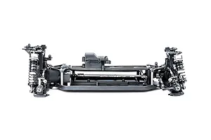Side view of an LRP Antix S10 Blast BX3 RC buggy chassis, showing the black plastic frame, suspension components, and central driveshaft on a white background.
