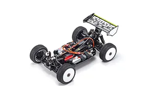 High-angle studio shot of the Kyosho Inferno MP10e 1/8 scale electric RC buggy chassis without body shell, showing internal components and white wheels.