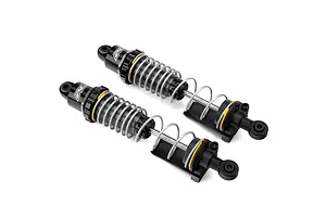 Two Pro-Line PowerStroke black aluminium RC shock absorbers with silver springs and yellow accents, shown against a white background.
