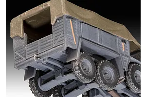 Close-up of the rear cargo bed and wheels of a 1/76 scale Krupp Protze KFZ 69 plastic model kit, showing grey plastic body and olive green canvas cover.