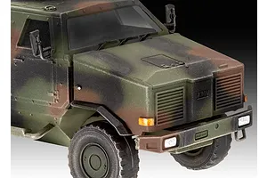 Close-up of a 1/72 scale plastic model of an ATF Dingo 1 military vehicle with camouflage paint.