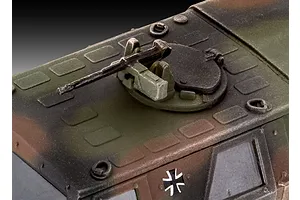 Close-up of the roof-mounted machine gun and hatch on a 1/72 scale Revell ATF Dingo 1 plastic model kit, featuring a camouflage paint scheme.