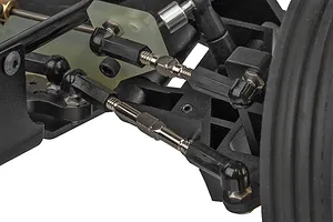 Close-up view of the front suspension and steering linkage assembly on a Team Associated RC10 buggy.