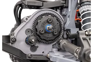 Close-up of the spur gear and pinion gear assembly on a Traxxas RC vehicle chassis, showing the 54T gear and surrounding suspension components.
