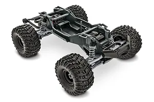 A high-angle studio shot of a Traxxas Stampede 2WD RC monster truck chassis without the body shell, showing the frame, suspension, and large treaded tires.