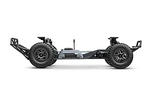 Side profile view of a Traxxas Slash 2WD RC truck chassis without the body shell, showing the frame, wheels, and suspension components.