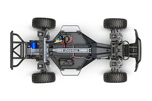 Top-down view of a Traxxas Slash 2WD RC truck chassis showing the internal components, motor, battery tray, and suspension system.