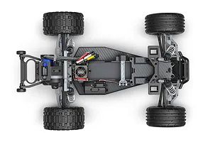 Top-down view of a Traxxas Rustler RC stadium truck chassis showing the motor, electronics, suspension, and tires on a white background.