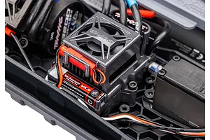 Close-up of the Traxxas Velineon VXL-3s electronic speed control unit installed in a Traxxas RC vehicle chassis.