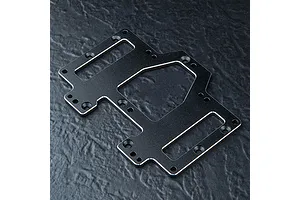 A black anodized aluminium battery and servo mounting plate for an RC car, featuring multiple screw holes and cutouts, resting on a dark textured surface.