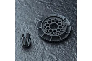 A black plastic 42T differential gear and an 11T pinion gear from MST, set against a dark, textured background.