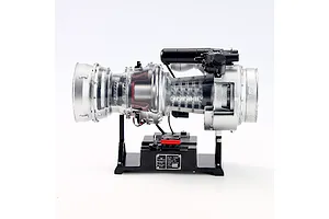 Side view of the Teching DM136 T-700 turboshaft engine model kit mounted on a black display base against a white background.