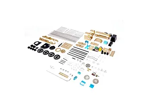 An exploded view of the Teching DM221 steam train model kit showing various metal parts, wheels, rods, and electronic components laid out on a white background.