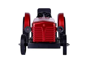 Front view of a red Teching DM616 metal tractor model kit featuring a star emblem on the hood and black wheels.
