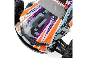 A close-up, high-angle view of a Pro-Line 1/16 Brute RC truck body shell featuring a digital camo pattern in orange, purple, black, and light blue.
