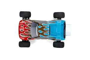 Top-down view of a Pro-Line Crowd Pleazer RC truck body shell with red, blue, and gold flame graphics, mounted on a small RC chassis.