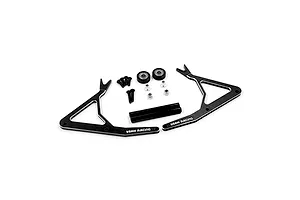 A disassembled black aluminium RC car stand kit by Yeah Racing, including two side frames, two support rods, bearings, screws, and nuts on a white background.