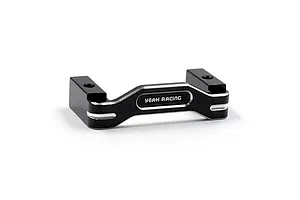 A black anodized aluminium servo mount by Yeah Racing with silver chamfered edges and the brand name engraved on the front.