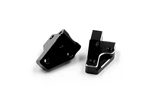 Two black anodized aluminium front lower arm mounts for RC cars, featuring machined edges and threaded mounting holes.