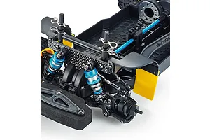 Close-up of the front chassis and suspension of a Killerbody Mars KR10 RC rally car, showing blue oil-filled shocks and a carbon fiber shock tower.