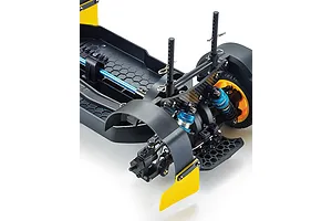 Close-up of the rear chassis assembly of a Killerbody Mars KR10 RC rally car, showing suspension, carbon fiber shock tower, and yellow mud flaps.
