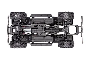 Top-down view of the Traxxas TRX-4 chassis showing the drivetrain, suspension, motor, and tires on a white background.
