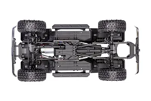Top-down view of the Traxxas TRX-4 chassis showing the drivetrain, suspension, motor, and tires on a white background.
