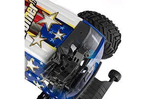 Close-up of an ARRMA RC monster truck body with a patriotic American flag design featuring stars and stripes, showing the chassis underneath.