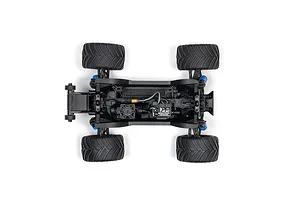 Top-down view of the ARRMA Grom RC monster truck chassis showing the motor, Spektrum electronics, and black rubber tires on a white background.