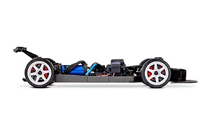 Side profile view of a Traxxas 4-Tec 2.0 RC car chassis without a body shell, showing the blue electric motor, white wheels, and black frame.