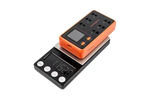 BetaFPV HexaCharger Pro 1S 6-port smart charger sitting on a digital scale showing a weight of 115.28 grams.