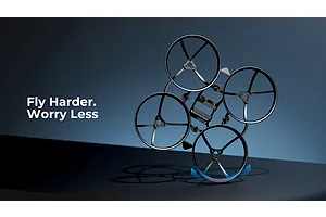 A black BetaFPV drone frame with integrated propeller guards, shown against a dark blue background with the text Fly Harder. Worry Less.