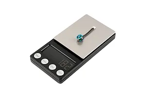 A single blue BetaFPV brushless motor being weighed on a digital scale showing 1.82 grams.